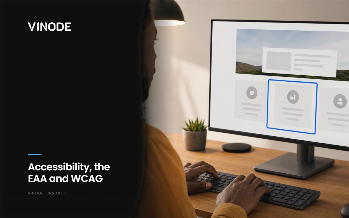 Person at a desk facing a monitor showing an accessible interface wireframe