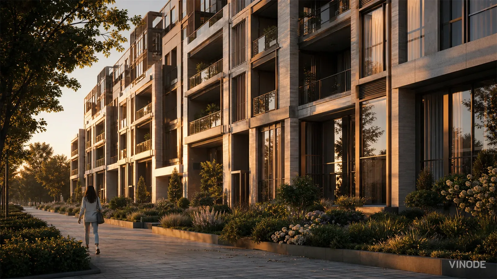 Sunlit apartment buildings beside a landscaped pedestrian walkway